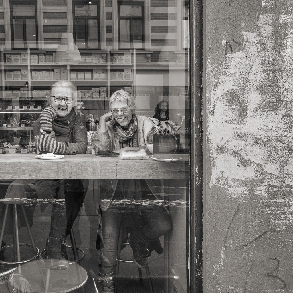 By using the click-and-step technique, I was able to move closer and capture this candid, joyful moment of two friends in an Oslo café—showing how confidence and gradual proximity can lead to more intimate and engaging street photos.