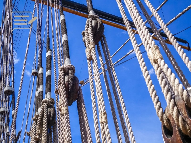 A close-up view of the intricate rigging ropes of the Cutty Sark, highlighting the craftsmanship and complexity that held the famous masts steady during her legendary voyages.
