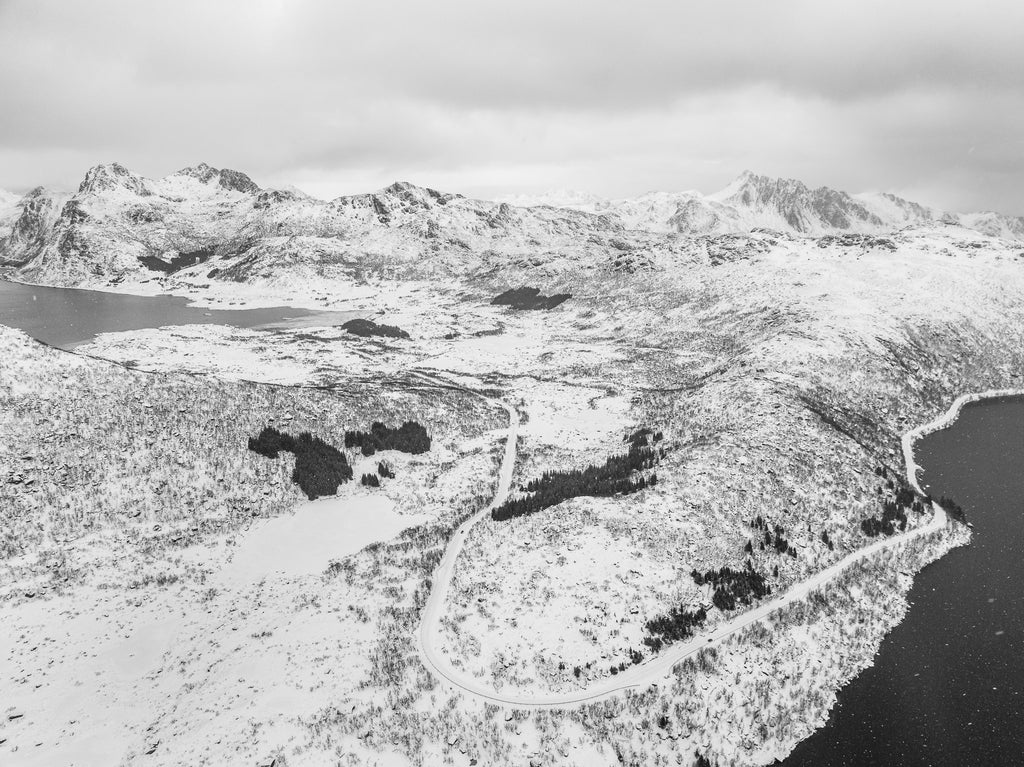 Aerial View of Norway's Snowy Landscape and North Sea