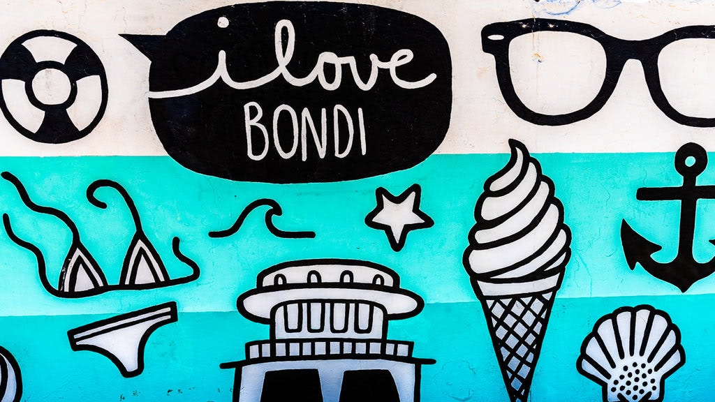 Street art with a message “I Love Bondi” in black and white icons.