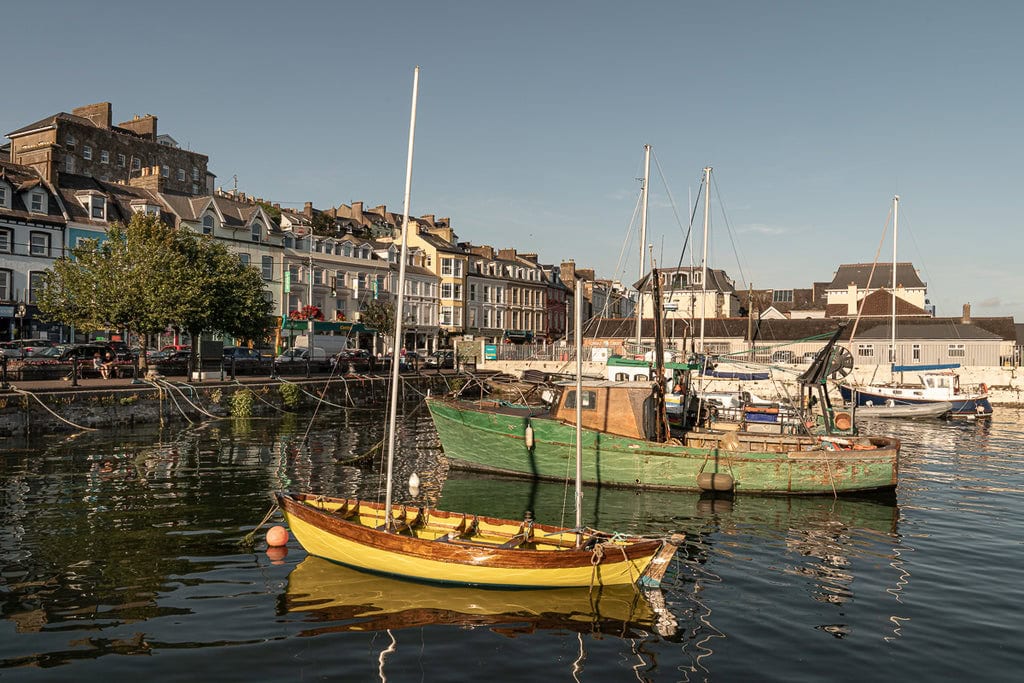 Sunset Serenity: Cobh's historic harbor basks in the golden glow of sunset, embodying Ireland's picturesque charm and maritime heritage.