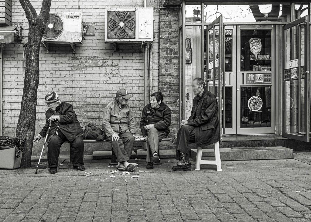 Captured while shooting from the hip, this image of elderly friends in Beijing offers a genuine glimpse into their everyday life—proving that sometimes the best moments are the ones you don’t see coming.