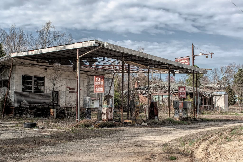 A relic of the past, this long-abandoned gas station in Georgia stands as a poignant reminder of bygone days, its rusted pumps and weathered structures whispering tales of erstwhile travelers and forgotten journeys.