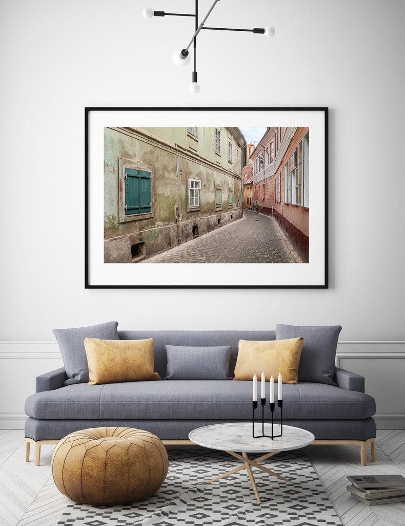 Wall art depicting nostalgic urban scenes.