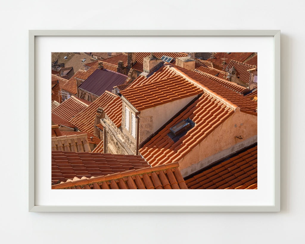 Detailed close-up of traditional Croatian roof tiles, highlighting their unique texture and terra cotta color.