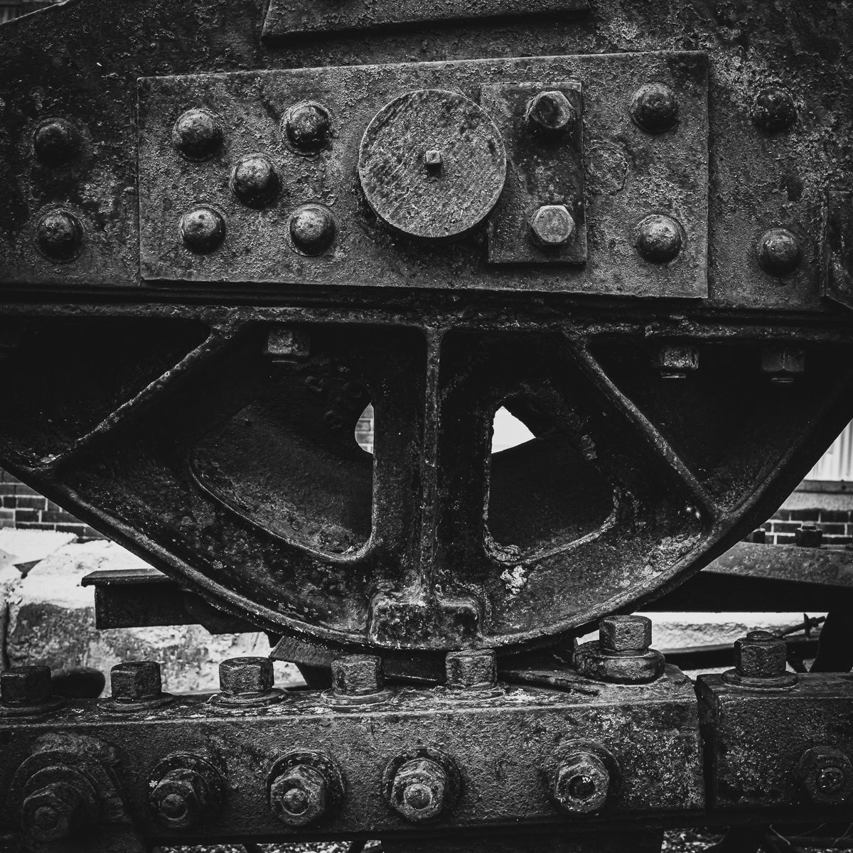 A relic of the industrial age—its rivets, rust, and weathered steel echo the power and decay of forgotten work.