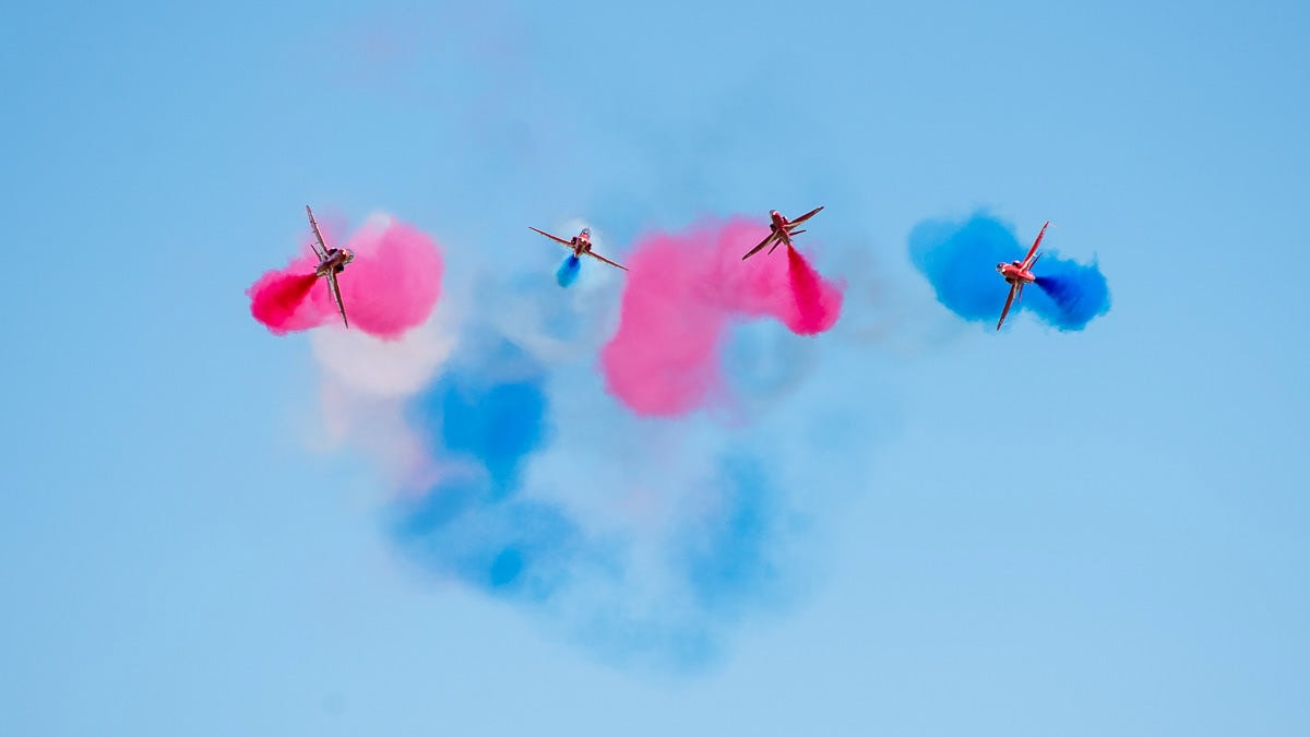 Red Arrows RAF aerobatic fly team with colourful smoke