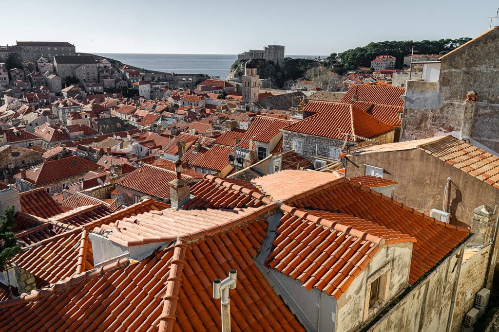Breathtaking panoramic view of Dubrovnik showcasing the vibrant Croatia roof tiles against the Adriatic Sea.
