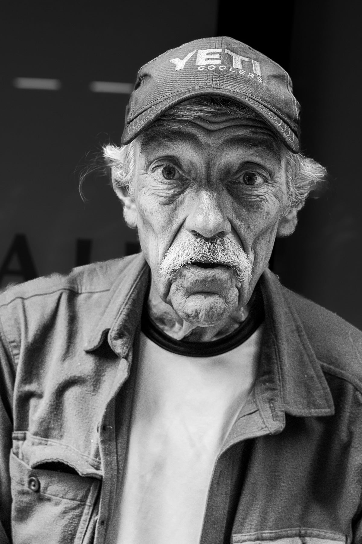 In this photo of a surprised look photo of an older man in New York, I spent 15 minutes talking to him and taking various street portraits with consent.