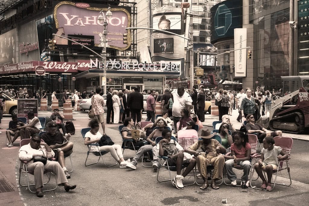 By blending into the background of Times Square, I captured this candid moment of people lounging in the middle of the bustling city—a perfect example of how patience and staying unnoticed can reveal the relaxed side of urban life.