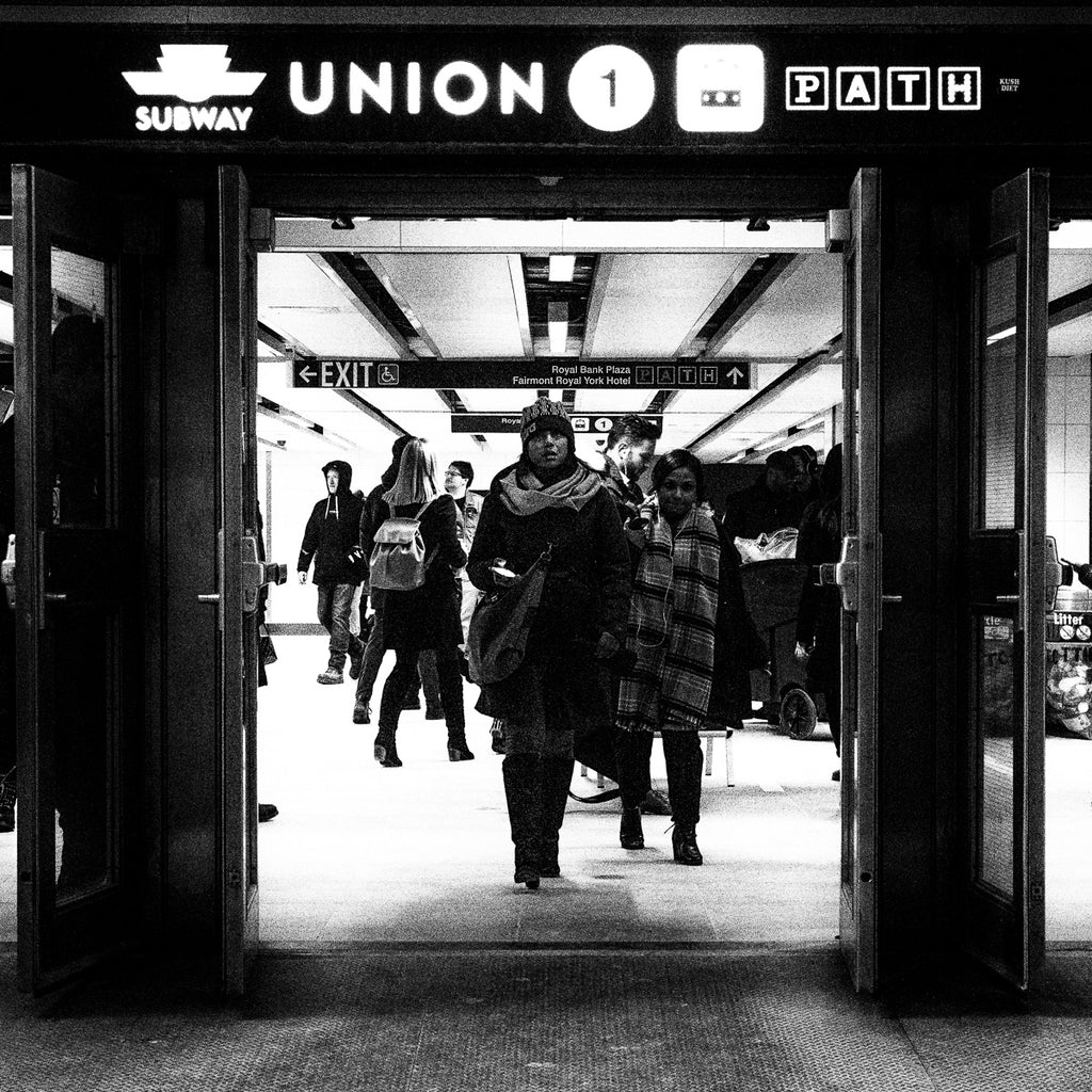 Open doors to Toronto Union train station of people continue their journey