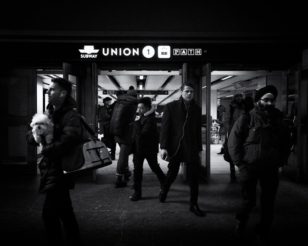 Group of people leaving Union station on cold winter night