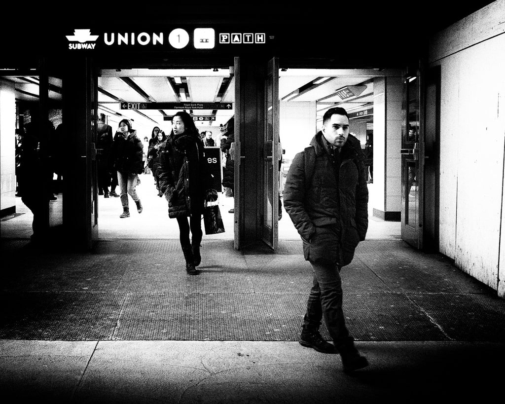 Crowds of people leave the busy Toronto Subway Station