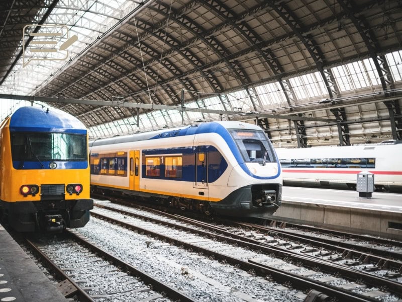 Springtime at Amsterdam’s Central Station—ideal for travelers looking to explore the city and beyond.