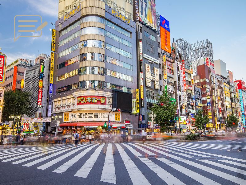 The bustling streets of Shibuya Crossing, Tokyo, during the day, capturing the fast-paced life of one of the world’s busiest pedestrian intersections.