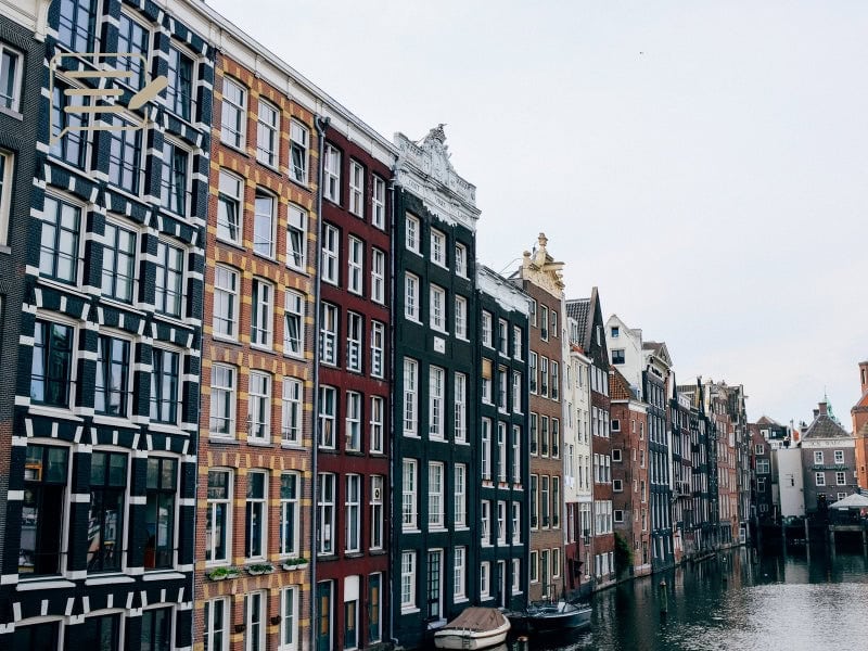 Amsterdam’s picturesque canal houses in the autumn, showcasing the city’s historic charm.