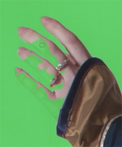 In Quick Mask mode, you can see where the Magic Wand got a little too aggressive. Paint over the missing fingers with white to recover them. 