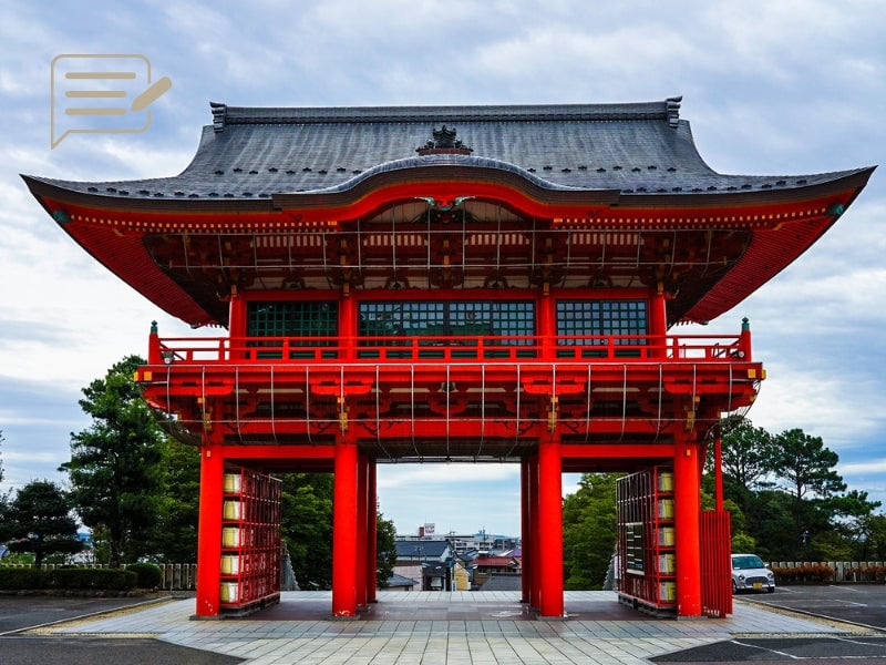 The iconic red Torii gate at the entrance of a Kyoto temple, symbolizing Japan’s rich cultural and spiritual heritage.