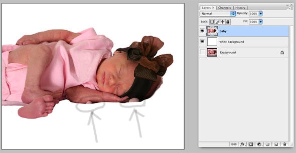 Close-up showing the baby with background erased. Arrows point to blanket folds sticking up. They need to be painted over.