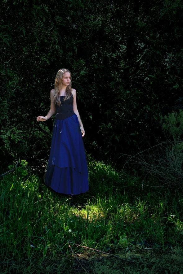 Dress is modified using Liquify, background is darkened with a layer of dark green.